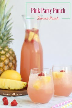 pink party punch with pineapple and raspberry garnish in two glasses