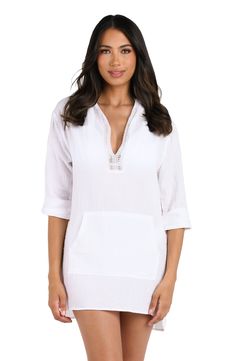 Model is wearing a white hooded cover up from our Seaside Covers collection! Spring Poolside Cover-up With Drawstring, Long Sleeve Poolside Cover-up For Vacation, Casual Long Sleeve Beach Cover-up Dress, Casual Long Sleeve Beach Dress Cover-up, Relaxed Fit Long Sleeve Cover-up For Vacation, Casual Tunic Tops For The Beach, Oversized White Cover-up For Loungewear, Relaxed Beach Cover-up Tops, Long Sleeve Poolside Cover-up For Resort Season