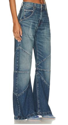 Bowed legAdjustable leg opening with tieSeam detailing at kneesHigh waisted 5-pocket designInseam: 33"Rise: 11" Jeans Models, Vintage Silhouette, Denim Crafts, Blue Dream, Faded Denim, Premium Denim, Denim Fabric, The Knee, Everyday Fashion