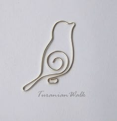 a piece of metal sitting on top of a white paper with the word truannann walk written below it