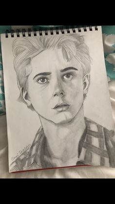 a pencil drawing of a young man's face