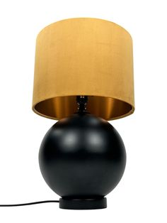 a black table lamp with a gold shade on it's base and a white background