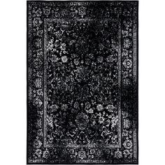 a black and white rug with an intricate design on the bottom, in front of a white background