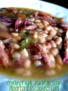 a white plate topped with beans and meat