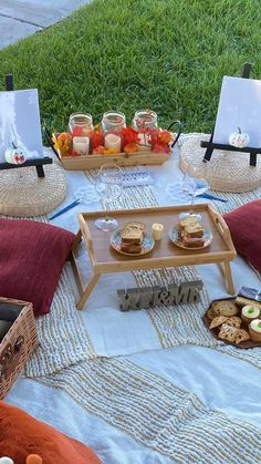 a picnic table with food and drinks on it