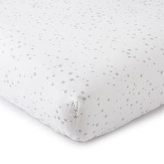 a white bed with stars on it