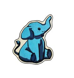 an elephant sticker sitting on top of a white surface