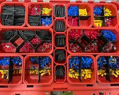 a red box filled with lots of different types of screwdrives