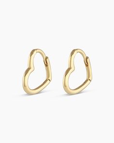 Add a little love to your ear stack with sweet, solid gold heart huggie hoop earrings. Make it a single Product Details 14k solid gold Heart measures 10.7 mm by 10.2 mm. 1.2mm thick Hinge closure | Mini Open Heart Huggies Earring, Women's by gorjana Minimalist Huggie Heart Earrings For Anniversary, 14k Gold Huggie Earrings For Valentine's Day, Gold Huggie Earrings For Valentine's Day, Valentine's Day 14k Gold Huggie Earrings, Valentine's Day Tarnish Resistant Huggie Earrings, Yellow Gold Small Hoop Huggie Earrings For Valentine's Day, Yellow Gold Huggie Earrings For Valentine's Day, Dainty Yellow Gold Huggie Earrings With Heart Charm, Valentine's Day Yellow Gold Small Hoop Huggie Earrings