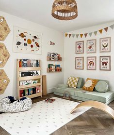 a living room filled with lots of furniture and pictures on the wall above it's bookshelf