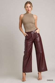 These pants are the epitome of chic and edgy style, crafted from high-quality faux leather that adds a touch of sophistication to any outfit. The straight leg design offers a timeless and flattering silhouette, making these pants a versatile choice for various occasions. Leather Wide Leg Pants Outfit, Burgundy Leather Pants Outfit, Light Pink Pants Outfit, Gaucho Pants Outfit, Straight Leg Pants Outfit, Edgy Chic Fashion, Leather Pants Street Style, Leather Pants Brown, Faux Leather Pants Outfit