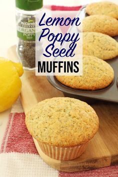 lemon poppy seed muffins are sitting on a cutting board next to some spices