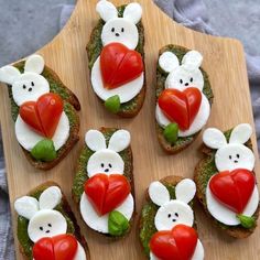 several pieces of bread with various food items on them, including carrots and tomatoes