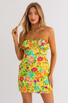 Ready for a dose of vacation bliss? Our Vacay Vibes Mini Dress is your ticket to a stylish getaway! Pack this must-have mini dress for your next adventure, and let it be a reminder of sun-kissed days and unforgettable memories. 100% Polyester Color: Lime Green Floral Print Strapless Back Tie Tube Style Mini Length Vacay Vibes, Kiss Day, Green Floral Print, Green Mini Dress, See You Again, Tube Dress, Floral Mini Dress, Sun Kissed, Egift Card