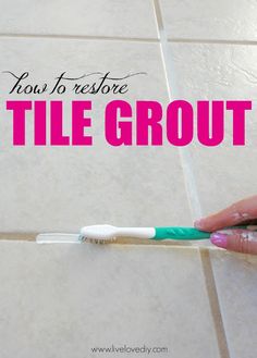 a person holding a toothbrush in their hand with the words how to restore tile grout