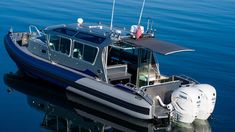 a blue and white boat in the water