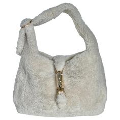 Gucci Jackie 1961 White Fluffy Shearling Bag Small The Gucci Jackie 1961 Black Small bag is a modern take on an iconic design. Crafted in white fluffy shearling and lined with leather, this "Teddy-like" rare super cute Jackie is your perfect accessory. CONDITION: NEVER WORN DETAILS: Brand: Gucci Model: Jackie 1961 Exterior Material: Shearling Exterior Color: White Interior Material: Suede Interior Color: White Hardware Color: Gold Size: Small Dimensions: Width: 28cm, Height: 18.5cm ACCESSORY: sh Gucci Marmont Super Mini, Shearling Bag, Gucci Jackie 1961, Marmont Super Mini, Gucci Marmont Bag, Ski Bunny, Winter Bags, Gucci Brand, Luxury Ski