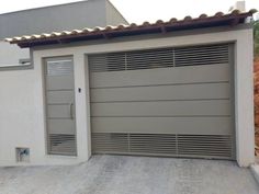 an image of a garage door with shutters on the front and side doors open