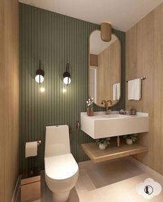 a bathroom with a toilet, sink and mirror