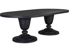 an oval table with two pedestals on each side