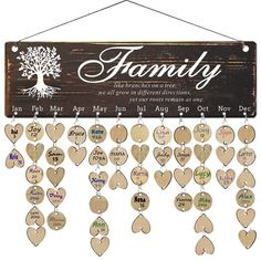 a family sign hanging on a wall with many different names and hearts attached to it