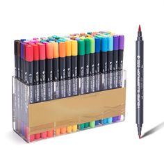 an assortment of markers and pencils are in a display case with the same color