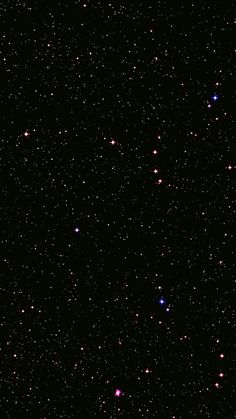 the sky is filled with many stars and small white dots on it's black background