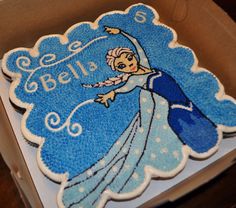 a frozen princess cake in a cardboard box