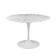 a white table with a marble top on an oval base, against a white background