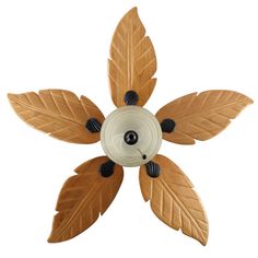 a decorative ceiling fan with leaves on it