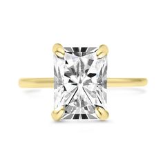 a yellow gold engagement ring with a princess cut diamond in the center and two tone band