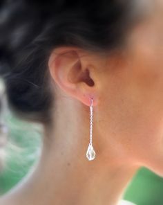 a close up of a person wearing earrings