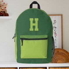 This cool and modern green backpack is ideal for your little boy if they need a new backpack. The backpack can be personalized with the inclusion of your choice of monogram initial which appears in a sports inspired font. This backpack could also make the ideal gift for any occasion. Green Preppy School Bag, Green Backpack For Students, Back To School, Green School Bag For Back To School, Green Back To School Bags, Customizable Green Travel Bags, Personalized Green Travel Bag, Sporty Customizable School Bags, Customizable Sporty School Bags, Green Standard Backpack For School