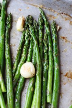 asparagus with garlic on a baking sheet