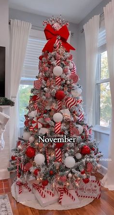 a christmas tree decorated with candy canes and ornaments in red, white and silver