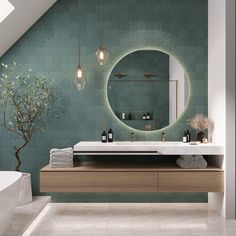 a bathroom with a sink, mirror and bathtub under a slanted skylight