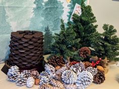 there are pine cones on the table next to each other, and two stacks of cookies