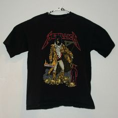 Pre-Owned Vintage METALLICA 1990’s Tour T Shirt. Metallica Tag/Brand. Hangman/Unforgiven design. Cotton Single Stitch. Made In USA. Size XL. Shirt is in very good condition with no holes or tears. Graphic design is in good condition on front and back. This is a pre-owned shirt, so the actual size may differ from the advertised size. Shirt measures 23 inches from armpit to armpit (chest), and 27.5 inches from collar to bottom of shirt along spine (length). If you aren't sure about Metallica Vintage, Metallica Tee, Fit Aesthetic, Fits Aesthetic, Muscle Shirts, Band Shirts, Tour T Shirts, T Shirt Men, Shirt Men