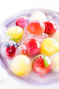 jelly candies are sitting on top of ice in a bowl