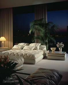 a living room filled with lots of white furniture