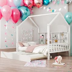 a bedroom with balloons and confetti all over the walls, including a bed