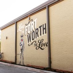 a mural on the side of a building that says fort worth, the lone man