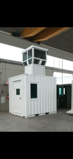 a large white container sitting inside of a building