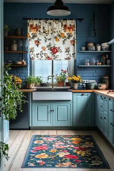 a kitchen with blue walls and wooden flooring is pictured in this image, the rug has flowers on it