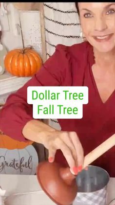 a woman in a red shirt holding a pot and wooden spoon with the words dollar tree fall tree on it