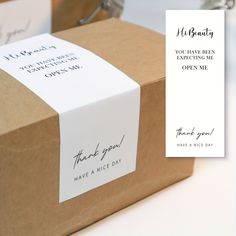 a brown box with a thank you note attached to the front and back of it