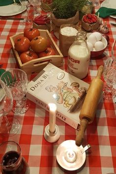 the table is set with an assortment of food and wine