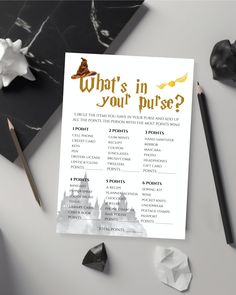 a printable harry potter quiz game on a table next to some pens and paper