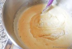 a mixing bowl filled with batter on top of a counter