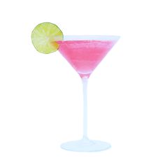 a pink drink with a lime slice on the rim in a coupe glass against a white background